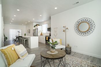 Large great room, dining room, and kitchen with island